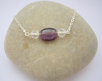 Purple oval bead and transparent beads