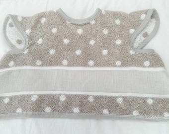 Bib covering embroidery colors: beige with white polka dots