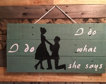 I do what she says sign