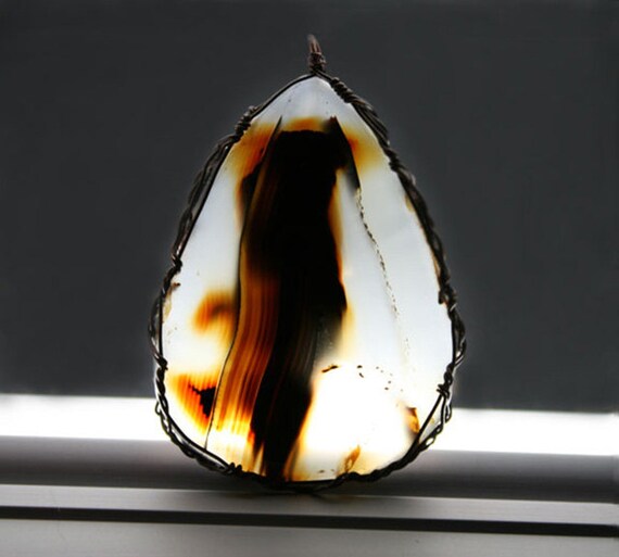 Montana moss agate cabochon wrapped in a Celtic style