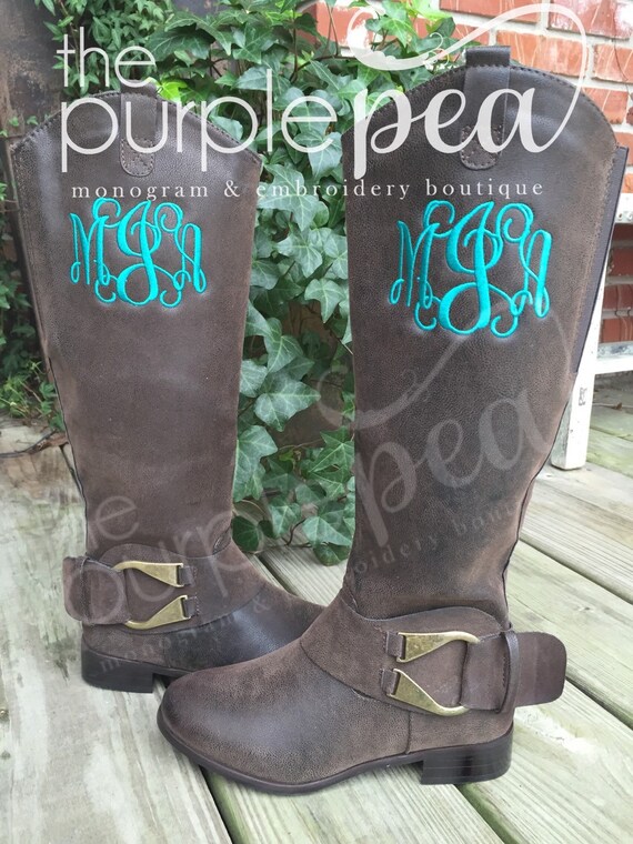 monogram plaque long leather boots