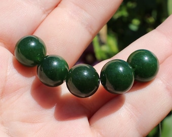 2 round Emerald beads faceted 10-11MM dark green. AR *.