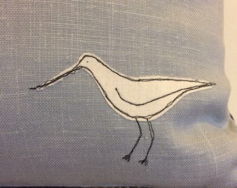 Duck egg blue linen cushion with appliqued bird