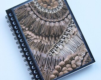 Alexander McQueen A6 (11x15cm) spiral-bound notebook made with "Catacomb' print paper.