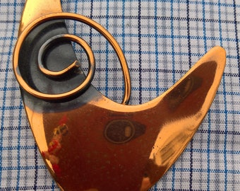 copper vintage brooch with a swirl