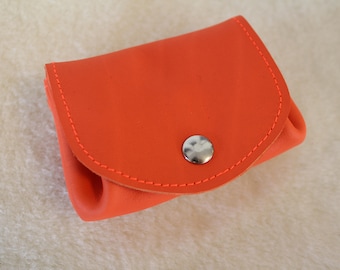 orange leather wallet. wallet; leather wallet. bright orange coin purse