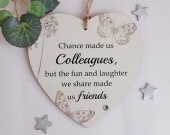 Chance made us colleagues, but the fun and laughter we share made us friends Wooden heart Plaque
