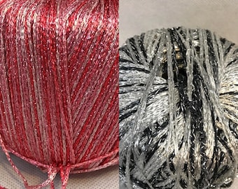 Red And Black Metallic Skeins Of Yarn