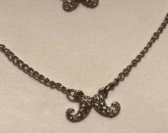 Triple strand mustache necklace