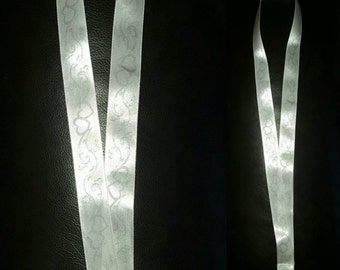 White lanyard with silver hearts