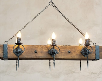 Wood beam and wrought iron chandelier for 6 lights.
