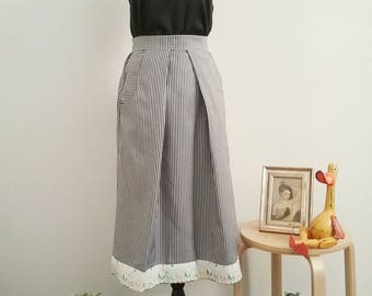 Striped skirt with detail on the bottom