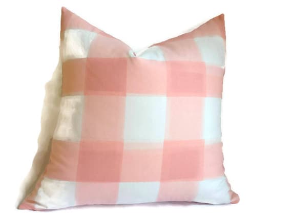 One of the easiest, and least expensive, spring decorating ideas for your living room is to change out your throw pillows. Whether your style is modern, minimalist, farmhouse, shabby chic, or vintage, throw pillows can give you the look that you want. This post shares 3 easy ways to change out your throw pillows, at 3 different price points! Tons of inspiration in this post. #throwpillow #spring #springdecorating 