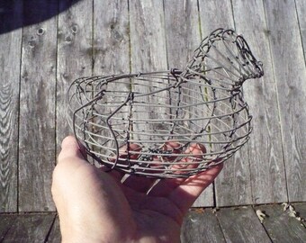 Vintage small wire chicken in a basket