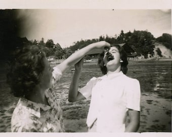 vintage photo 1950 Young Lady Feeds Teenage Girl Crab from the Lake Snapshot photo