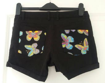 Upcycled black jeans/hotpants with psychedelic butterflies. EU size 36.