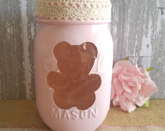 Pint size Mason jar with teddy bear cutout in light pink.