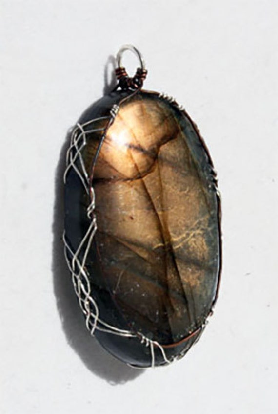 Labradorite pendant wrapped Celtic style with sterling silver and copper