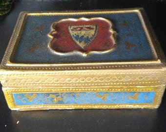 Wooden box with shield.