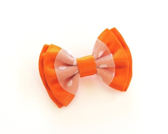 orange satin bow and white tulle brooch