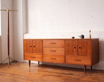Mid Century Modern Walnut Dresser with Brass Pulls and Ebonized Tabs