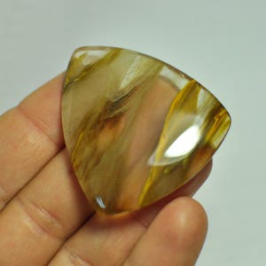 100% Natural Cherry Quartz Triangle shape Cabochon Gemstone Clear Orange Brown Color. 47x42x6 mm. 78.95 Cts.