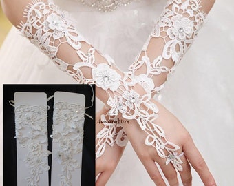 Light ivory beaded wedding gloves / bridal lace gloves / floral appliques is for sale. Sold By pair