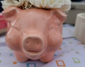 Ceramic peach pig filled with Sola wood flowers