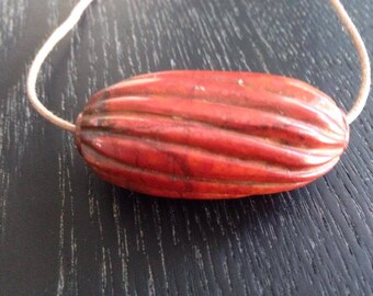 Hand Carved Cuprite Bead.