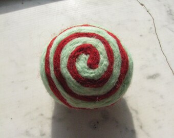 One multi-colored felted pin-cushion, Red and Mint Green
