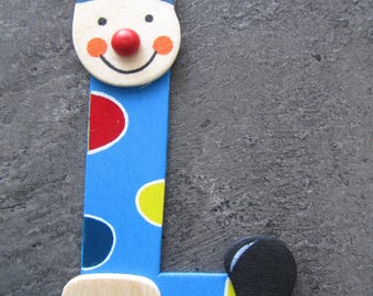 Painted wood - representing the letter "L" in the form of a clown