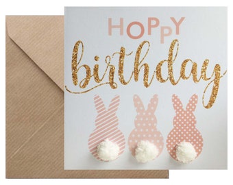 Cute rabbit 'Hoppy birthday' card, hand finished with three pompom 'tails'