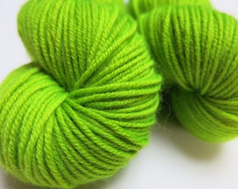 Patsy / Nuclear Goo / Kettle dyed / UV Reactive Yarn / superwash merino dk wool / black light reactive green / rave festival knitting