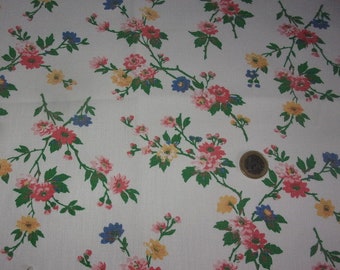 An antique fabric branches of flowers on an ecru background