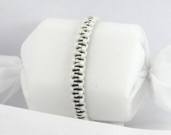 Black technique striped White Paracord Bracelet.