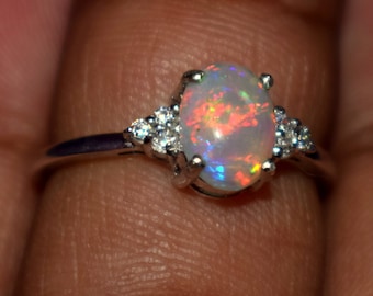 A Dazzling 6 x 8 MM Natural Ethiopian fire opal Gemstone Ring Fine Jewelry stunning set in sterling silver Size is ( US 7 ) 0066