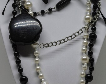 Busy black and white tone necklace