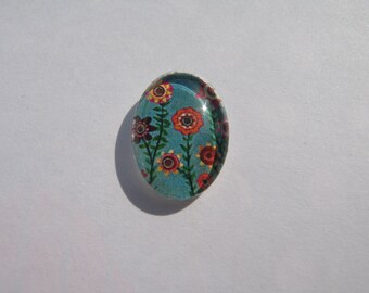 Cabochon 18 X 13 mm oval with a geometric image