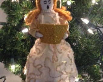 Christmas Caroler in festive dress