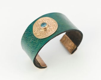 textured leather cuff/bronze component