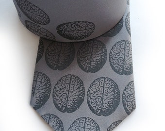 Brain dot men's silk tie. Silkscreened necktie, dove gray print. Perfect for zombie lovers. Your choice of color and width.