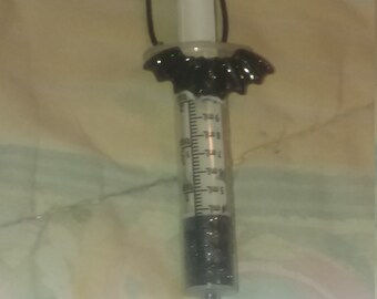 Plastic syringe necklace