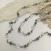 19.5 inches of antique silver and clear glass bicone beaded chain