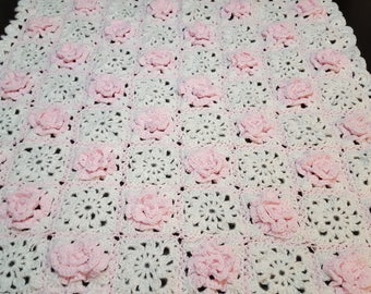 Pink flowers and white granny square baby blanket
