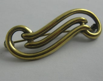 Fashion jewelry. Golden AMERIKANER brooch / pin made of metal. Probably 60s. Vintage