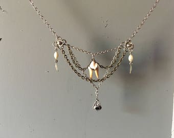 Raccoon tooth and onyx pendant necklace