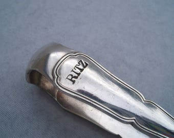 Ritz brand. French Vintage Silver Plate Sugar Tongs 1930's Art Deco Style . It have a french hallmark