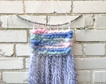 Pastel weaving with gray/white fringe