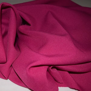 Raspberry or Dark pink 1Gabardine 100% Polyester. Shipping 6.00 first yard all others 1.50. Free swatches available upon request