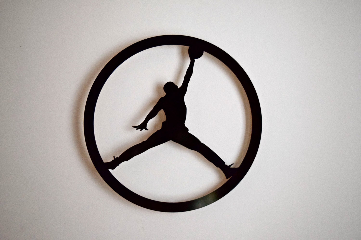 Circle Jump Man Logo Floating Metal Wall Art